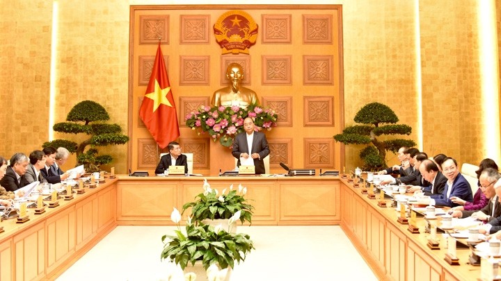 Le Premier ministre Nguyên Xuân Phuc préside la réunion du Conseil consultatif national de Politique financière et monétaire. Photo : Trân Hai/NDEL.