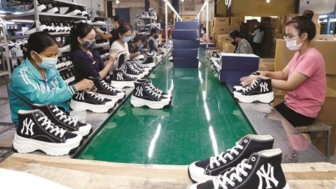 Ces premiers mois de 2022, les exportations vietnamiennes de produits en cuir et de chaussures se sont bien portées avec une forte croissance en valeur observée dans la plupart des débouchés. Photo : VNA/CVN.